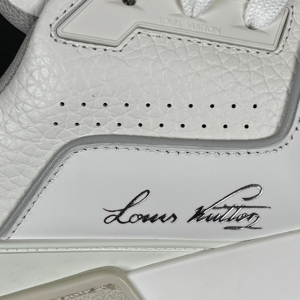 Louis Vuitton LV Trainer White Grey 1A8WAV men’s sneaker with smooth and grained white calf leather, LV branding and Monogram Flower rubber outsole, side view.