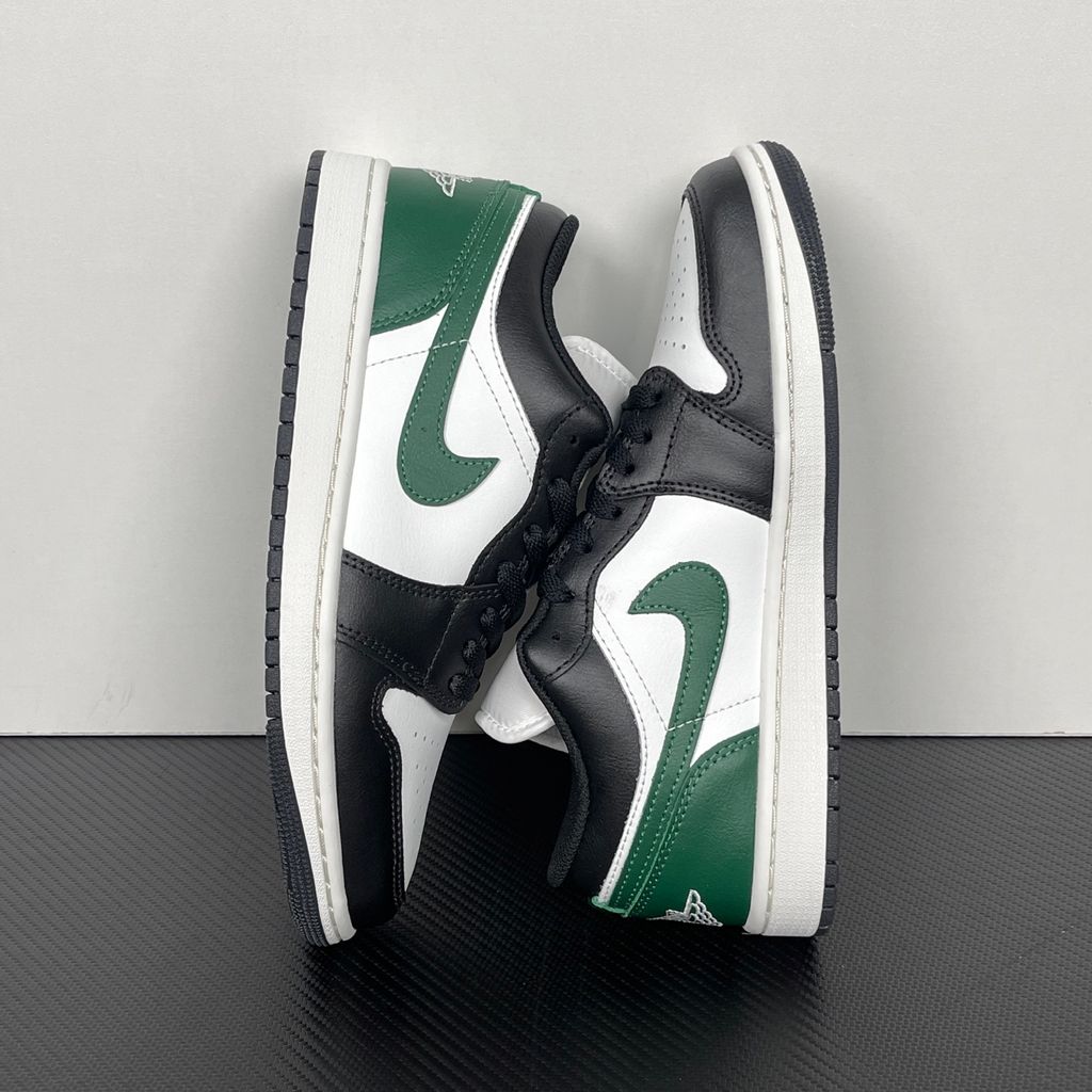 Air Jordan 1 Low Black Gorge Green 553558-047 men’s sneaker with a black leather upper, green accents, Summit White midsole and rubber outsole, side view.