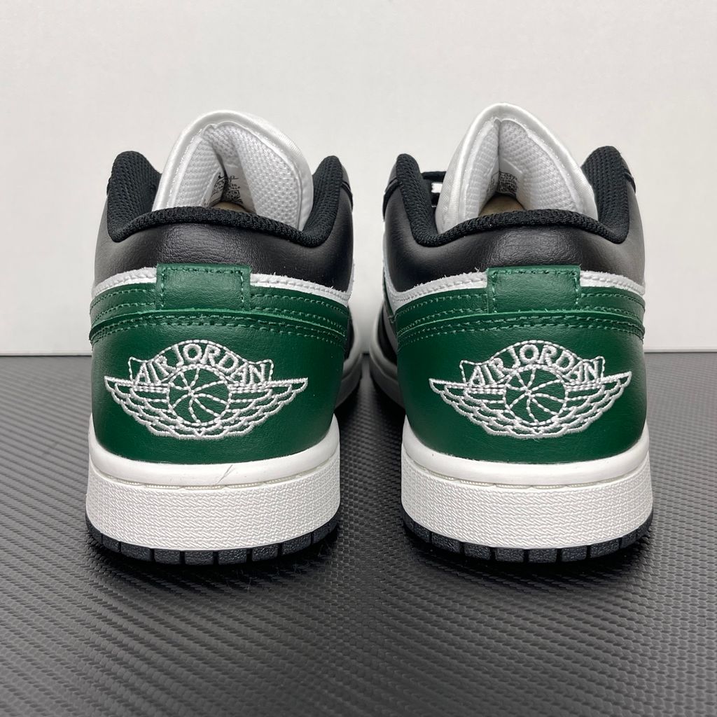 Air Jordan 1 Low Black Gorge Green 553558-047 men’s sneaker with a black leather upper, green accents, Summit White midsole and rubber outsole, side view.