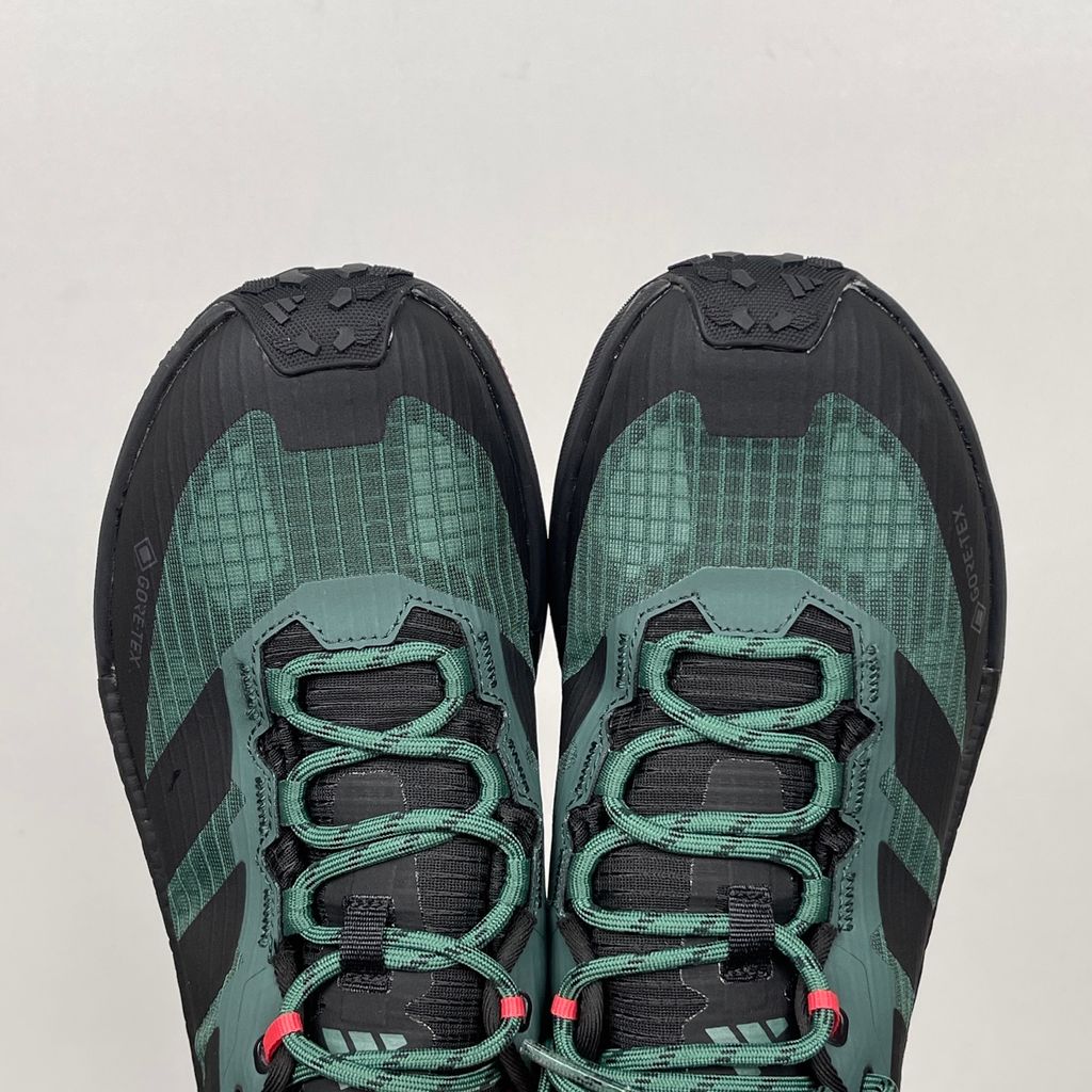 adidas TERREX Freehiker 3 Low GORE-TEX Collegiate Green KI8278 men’s hiking shoe with a green ripstop upper, black accents and Continental trail outsole, side view.