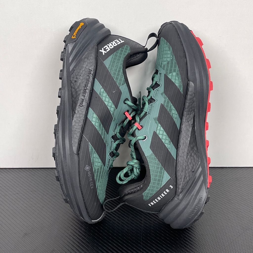 adidas TERREX Freehiker 3 Low GORE-TEX Collegiate Green KI8278 men’s hiking shoe with a green ripstop upper, black accents and Continental trail outsole, side view.