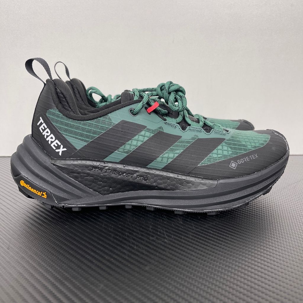 adidas TERREX Freehiker 3 Low GORE-TEX Collegiate Green KI8278 men’s hiking shoe with a green ripstop upper, black accents and Continental trail outsole, side view.