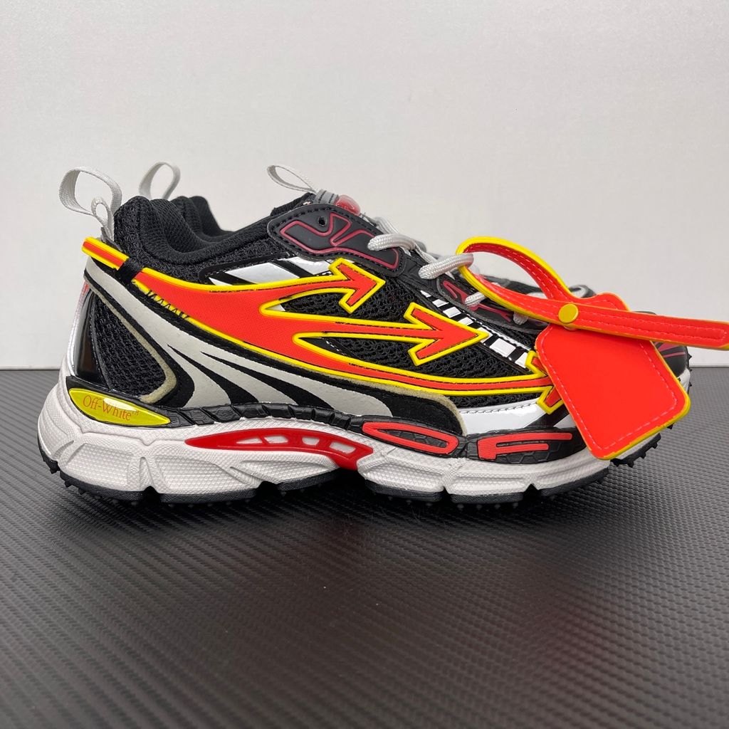 Off-White Be Right Back Black Coral Red OMIA295S26FAB0051026 men’s sneaker with black mesh, coral red and yellow Arrow overlays, silver panels and orange zip tie, side view.