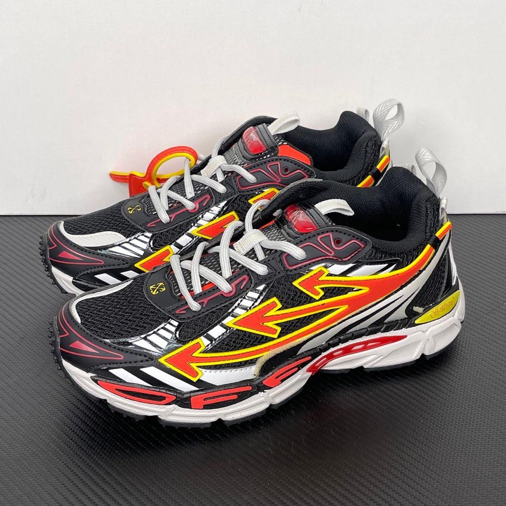 Off-White Be Right Back Black Coral Red OMIA295S26FAB0051026 men’s sneaker with black mesh, coral red and yellow Arrow overlays, silver panels and orange zip tie, side view.