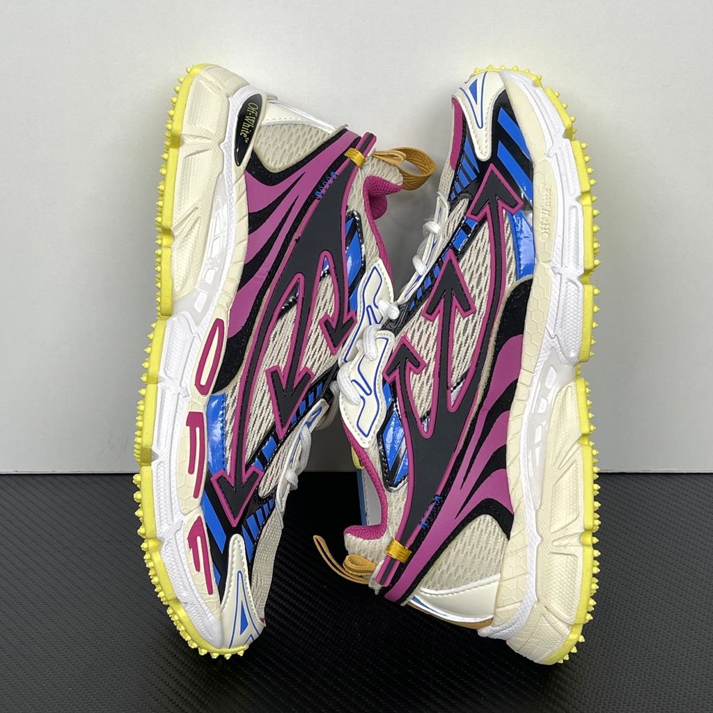 Off-White Be Right Back Magenta Royal Blue OWIA289S26FAB006-3969 women’s sneaker with ivory textile panels, black Arrow motifs and yellow rubber outsole, side view.