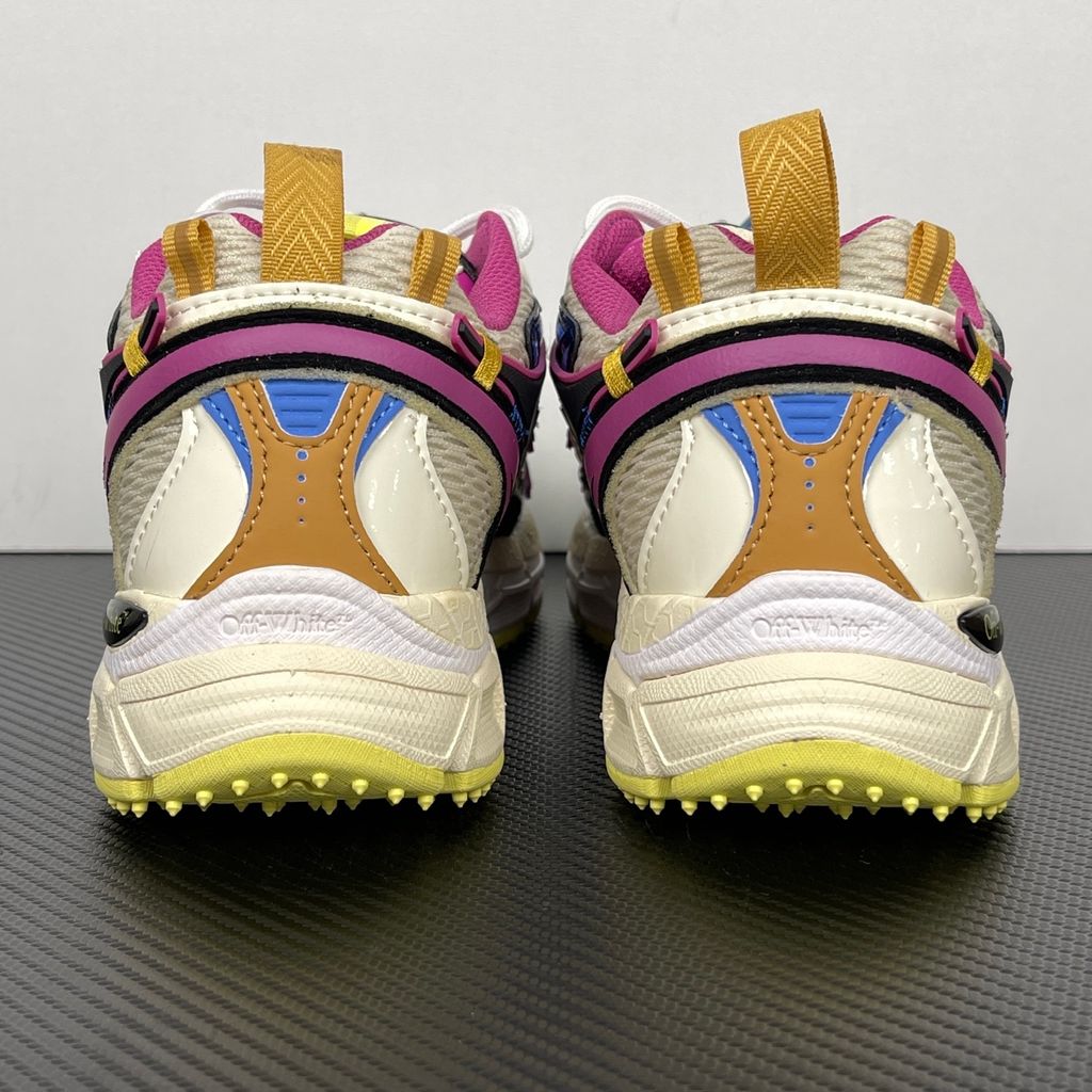 Off-White Be Right Back Magenta Royal Blue OWIA289S26FAB006-3969 women’s sneaker with ivory textile panels, black Arrow motifs and yellow rubber outsole, side view.