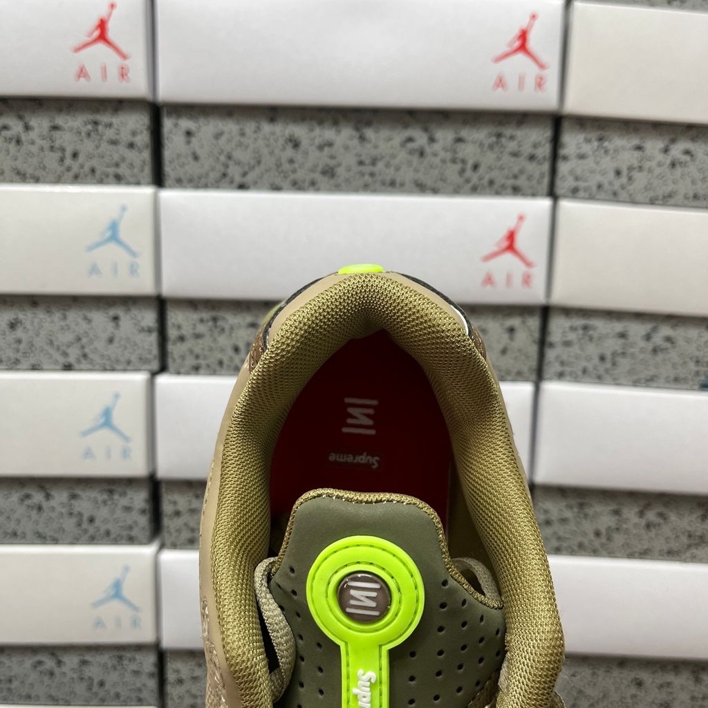 Supreme x Nike Shox Ride 2 Neutral Olive DN1615-200 sneaker with olive mesh, leather and nubuck panels, Electric Green accents and Supreme-branded Shox heel pillars.