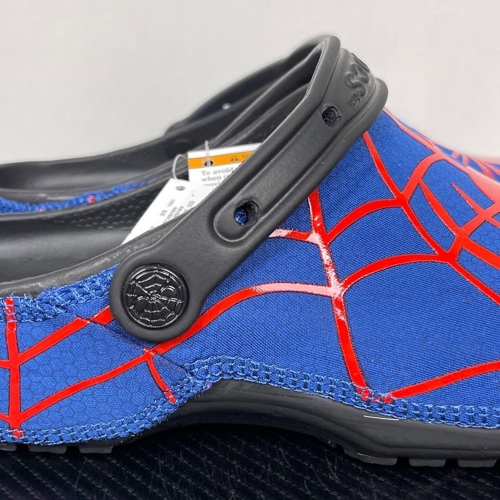 Crocs x Marvel Spider-Man Neo Classic Clog Multi 211489-90H with blue upper, red spider-web graphics, black pivoting heel strap and Spider-Man emblem.