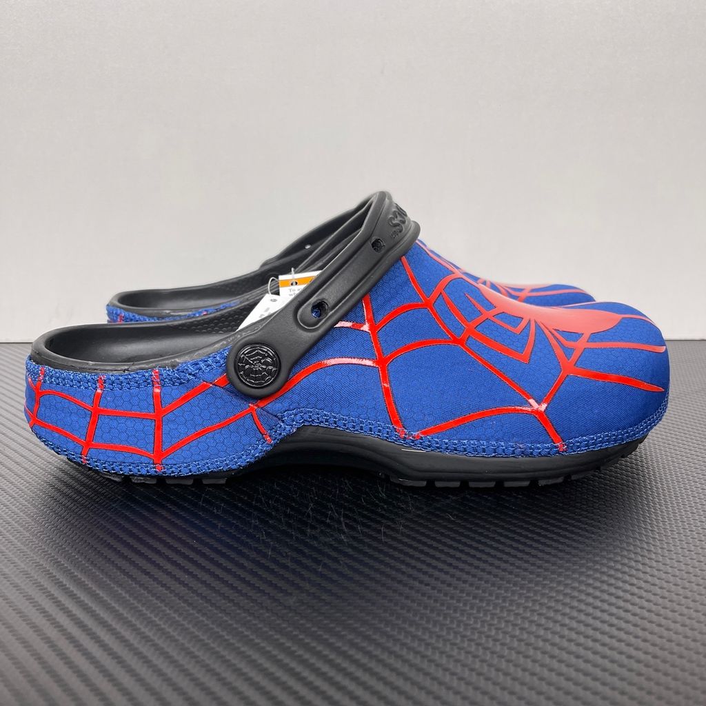 Crocs x Marvel Spider-Man Neo Classic Clog Multi 211489-90H with blue upper, red spider-web graphics, black pivoting heel strap and Spider-Man emblem.