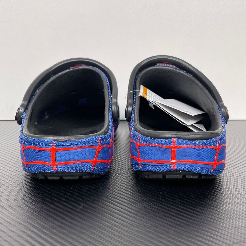 Crocs x Marvel Spider-Man Neo Classic Clog Multi 211489-90H with blue upper, red spider-web graphics, black pivoting heel strap and Spider-Man emblem.