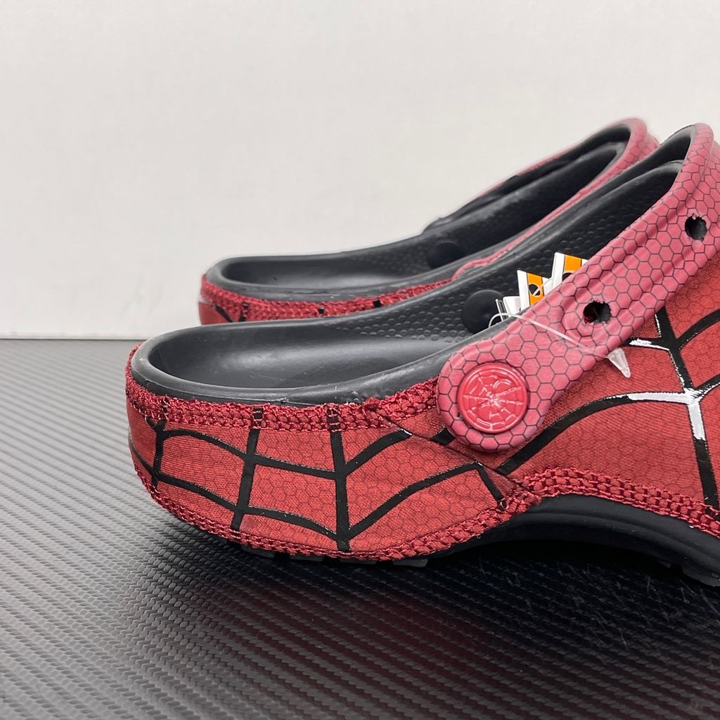 Crocs x Marvel Spider-Man Neo Classic Clog Red Black Multi 211489-90H with black web graphics, silver Spider-Man detailing and pivoting red heel strap.