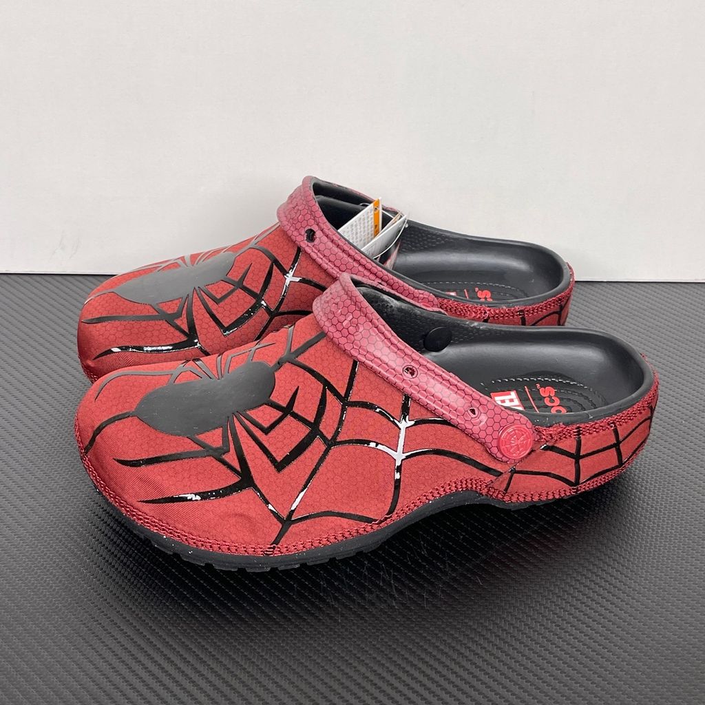 Crocs x Marvel Spider-Man Neo Classic Clog Red Black Multi 211489-90H with black web graphics, silver Spider-Man detailing and pivoting red heel strap.