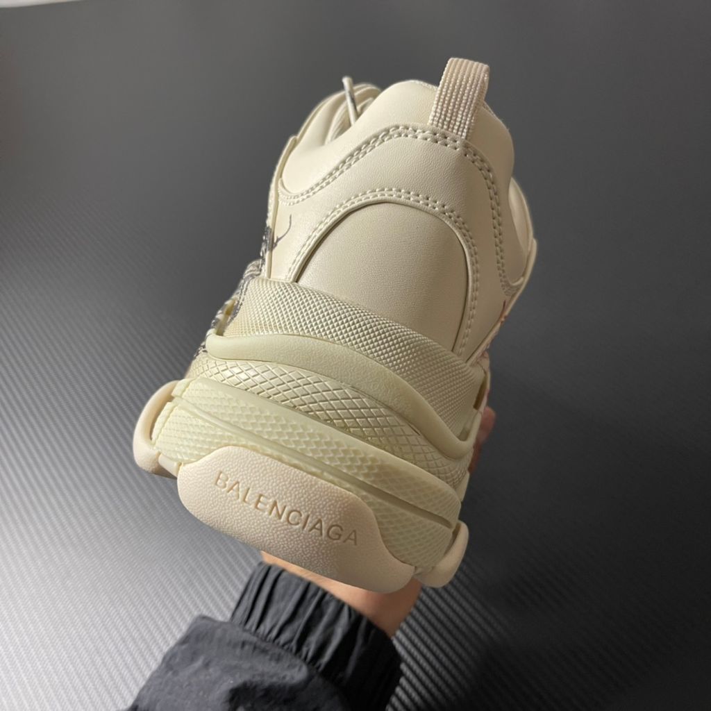 Balenciaga Triple S Graffiti Off-White 536737W2FAY9016 luxury chunky sneaker with red graffiti logo, side profile view.