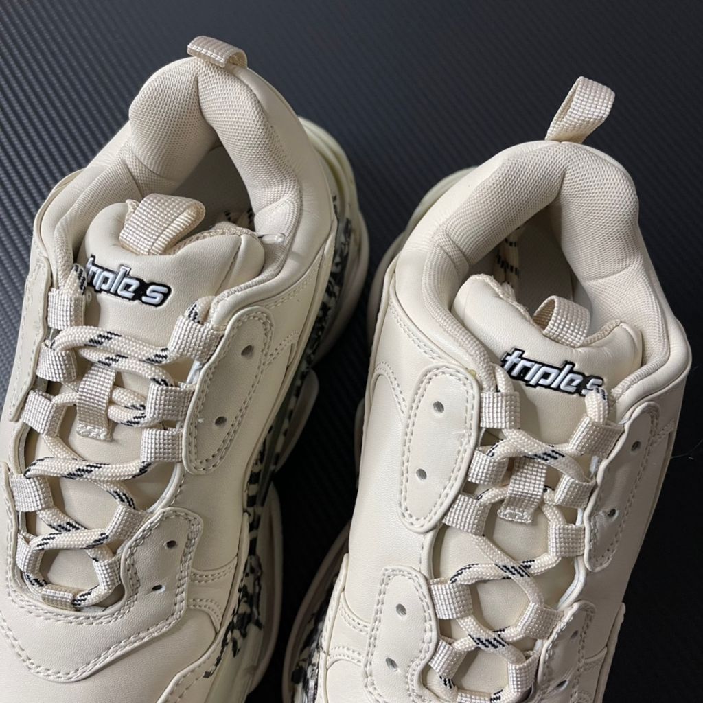 Balenciaga Triple S Graffiti Off-White 536737W2FAY9016 luxury chunky sneaker with red graffiti logo, side profile view.
