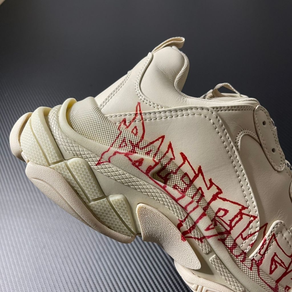 Balenciaga Triple S Graffiti Off-White 536737W2FAY9016 luxury chunky sneaker with red graffiti logo, side profile view.