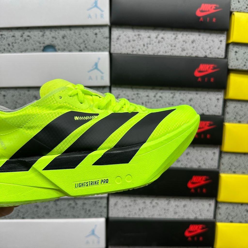 Shop adidas Adizero Adios Pro 4 JR6364 in Lucid Lemon, Core Black and Halo Silver with LIGHTSTRIKE PRO, ENERGYRODS 2.0 and Continental race traction.
