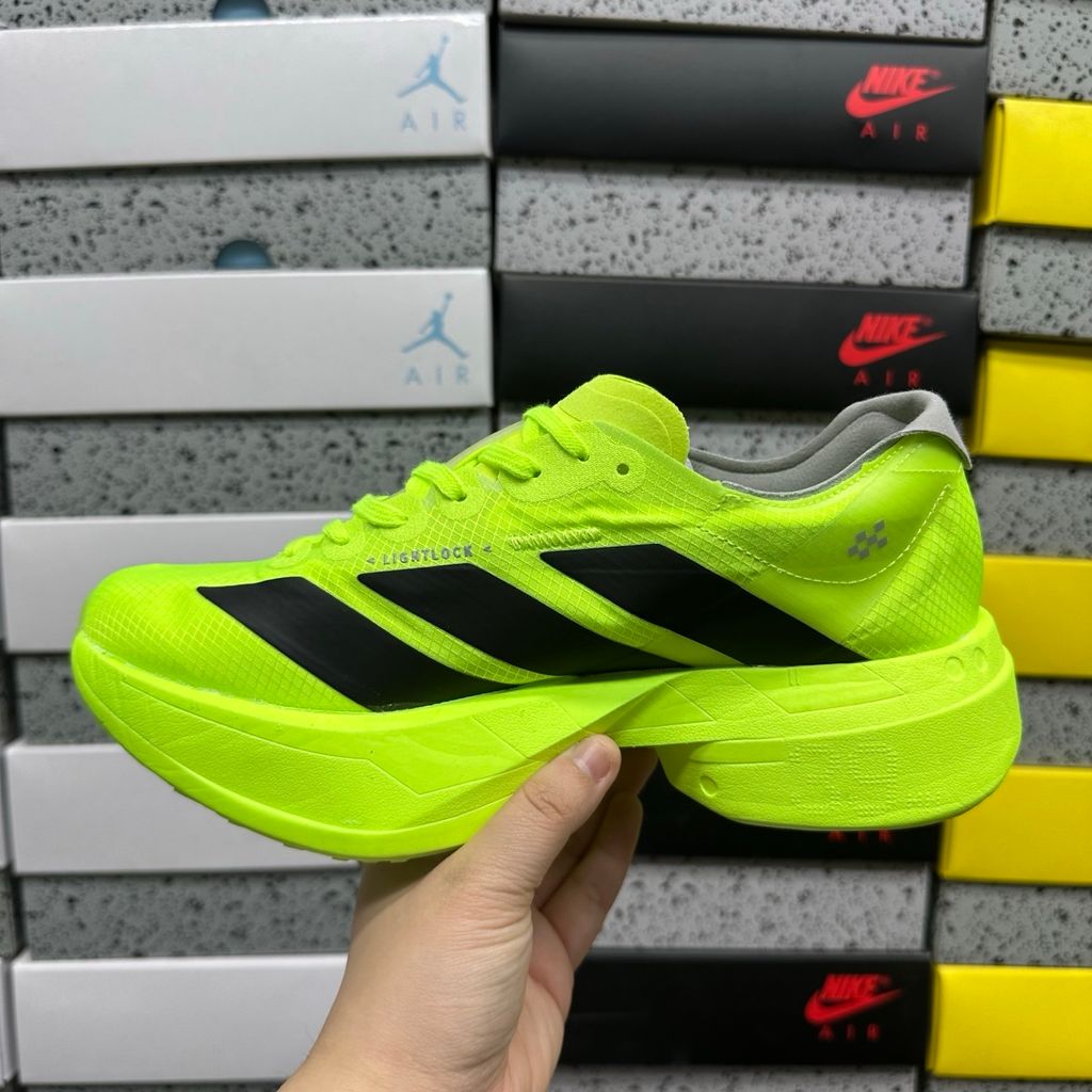 Shop adidas Adizero Adios Pro 4 JR6364 in Lucid Lemon, Core Black and Halo Silver with LIGHTSTRIKE PRO, ENERGYRODS 2.0 and Continental race traction.