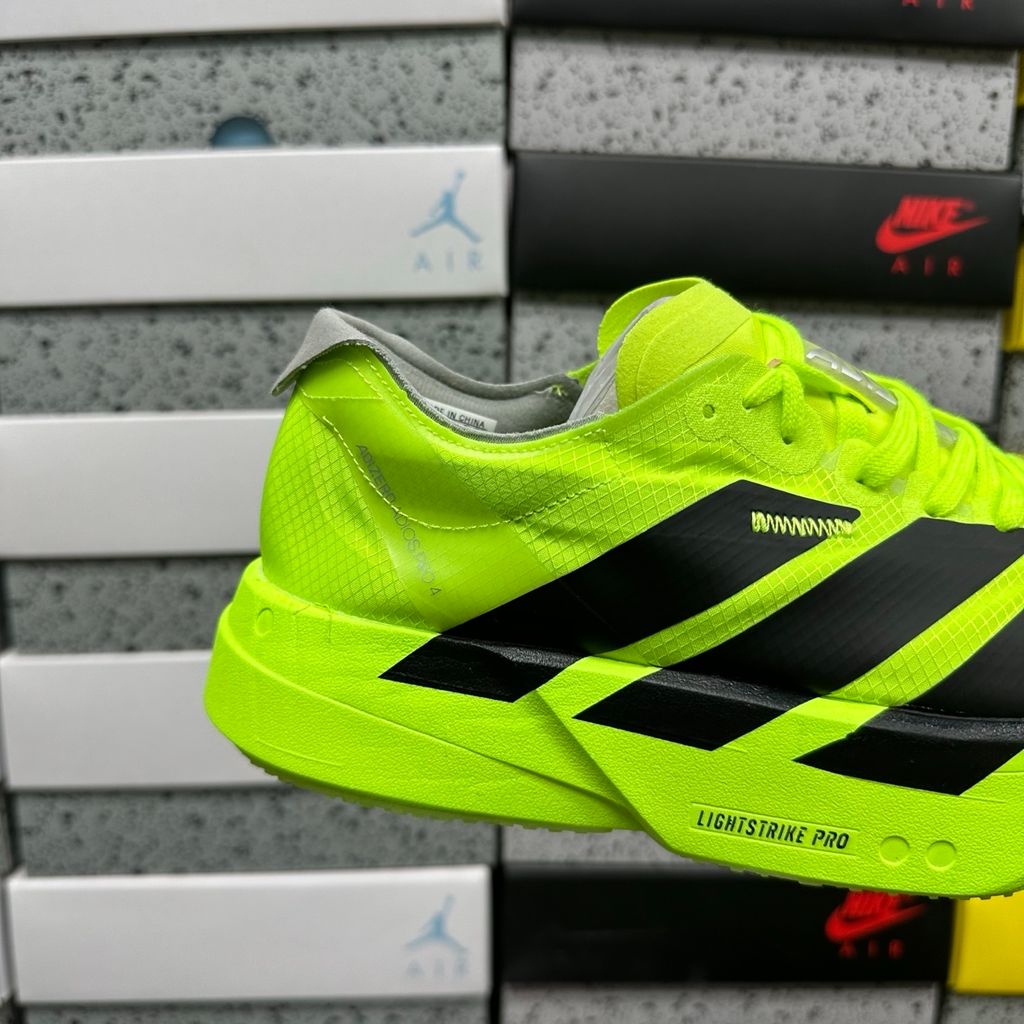 Shop adidas Adizero Adios Pro 4 JR6364 in Lucid Lemon, Core Black and Halo Silver with LIGHTSTRIKE PRO, ENERGYRODS 2.0 and Continental race traction.