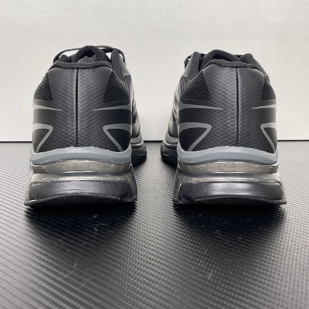 Shop MM6 Maison Margiela x Salomon XT-MM6 L49200300 in Black and Grey with technical mesh, layered synthetic overlays, MM6 graphics and a sculpted rubber sole.