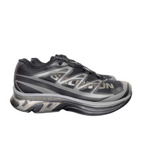 Shop MM6 Maison Margiela x Salomon XT-MM6 L49200300 in Black and Grey with technical mesh, layered synthetic overlays, MM6 graphics and a sculpted rubber sole.