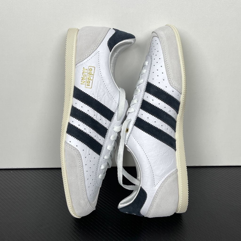 Shop adidas Japan IH5489 in Cloud White, Core Black and Gold Metallic with a leather upper, double-stitched T-toe and archival 1964 low-profile styling.