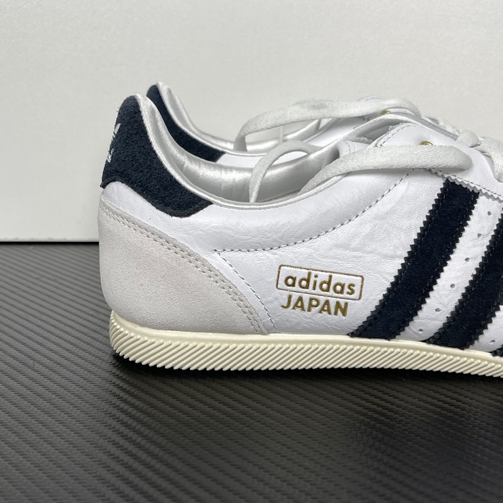 Shop adidas Japan IH5489 in Cloud White, Core Black and Gold Metallic with a leather upper, double-stitched T-toe and archival 1964 low-profile styling.