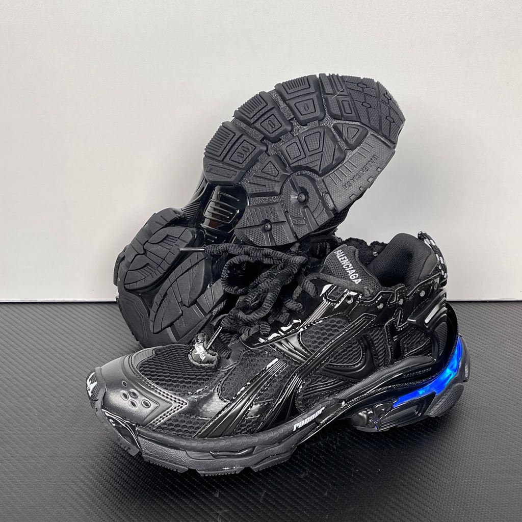 Shop Balenciaga Runner LED 853225 WRNLD 1000 in Black with layered technical construction, worn-out detailing, integrated LED sole and USB charging cable.