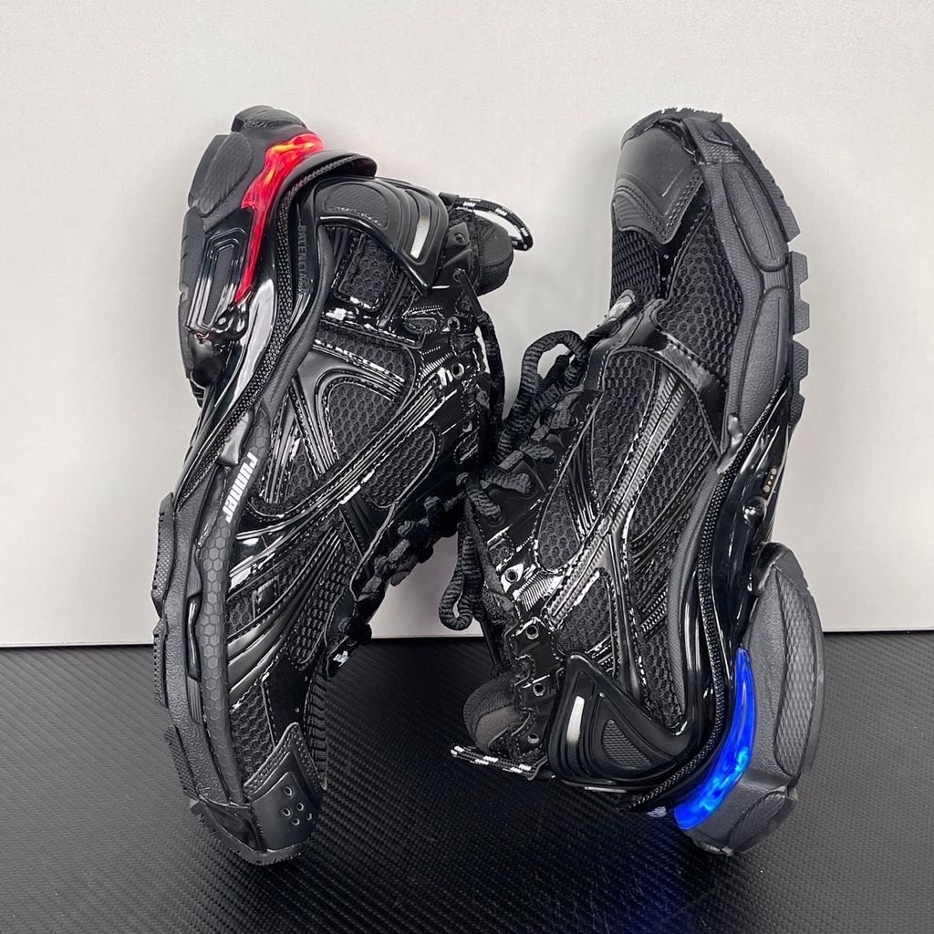 Shop Balenciaga Runner LED 853225 WRNLD 1000 in Black with layered technical construction, worn-out detailing, integrated LED sole and USB charging cable.
