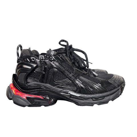 Shop Balenciaga Runner LED 853225 WRNLD 1000 in Black with layered technical construction, worn-out detailing, integrated LED sole and USB charging cable.