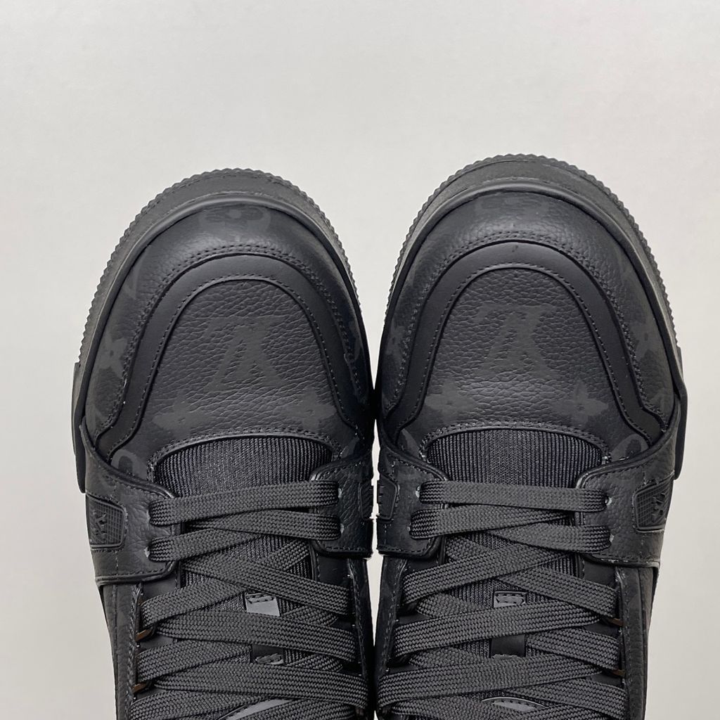Shop Louis Vuitton LV Trainer Sneaker 1AHDBE in Noir Black with Monogram grained calf leather, rubber signatures, Monogram Flower outsole and Italian craftsmanship.