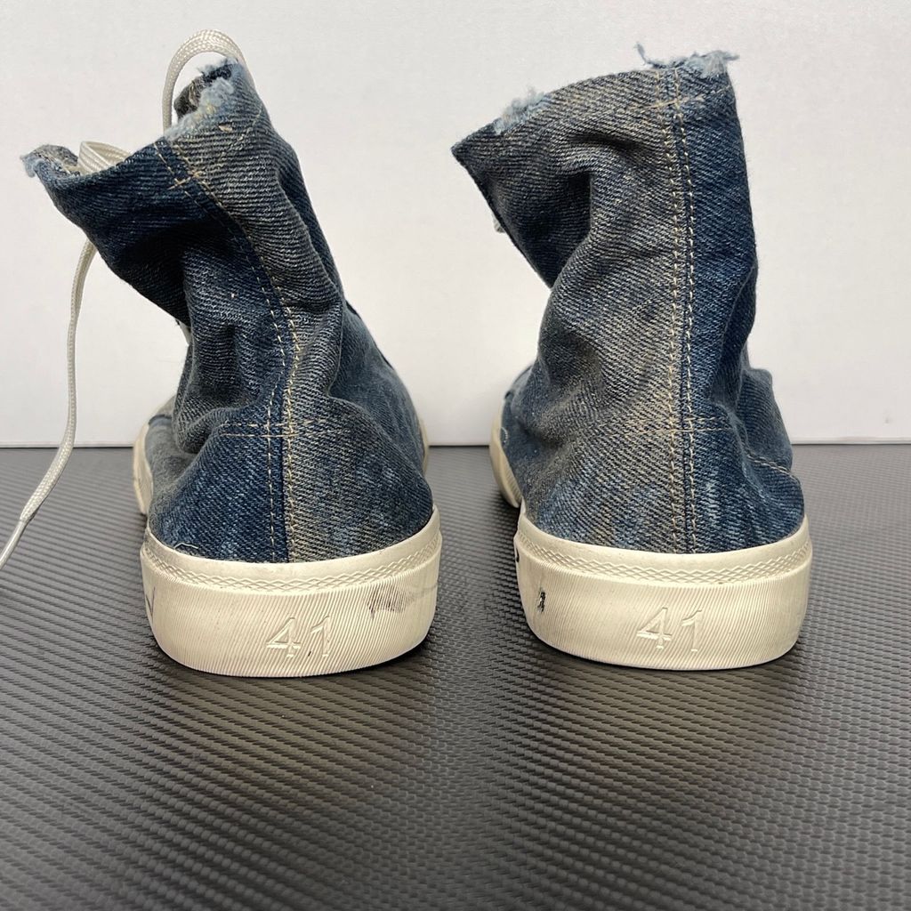 Shop Balenciaga Paris High Top 688752 W3RCL 4090 in Denim Blue with a destroyed denim upper, intentional vintage distressing and aged rubber sole.