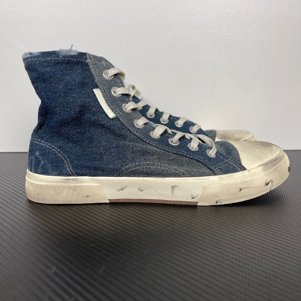 Shop Balenciaga Paris High Top 688752 W3RCL 4090 in Denim Blue with a destroyed denim upper, intentional vintage distressing and aged rubber sole.