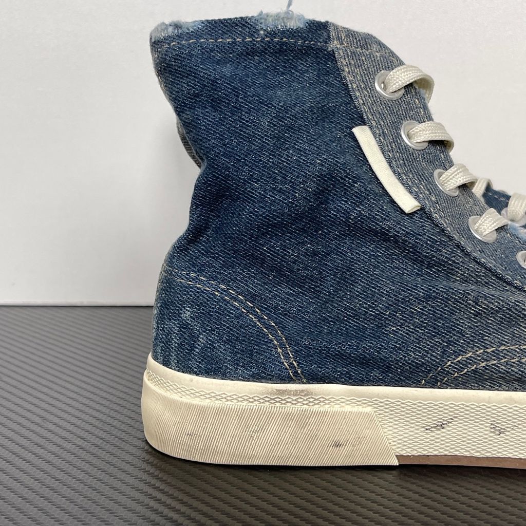 Shop Balenciaga Paris High Top 688752 W3RCL 4090 in Denim Blue with a destroyed denim upper, intentional vintage distressing and aged rubber sole.
