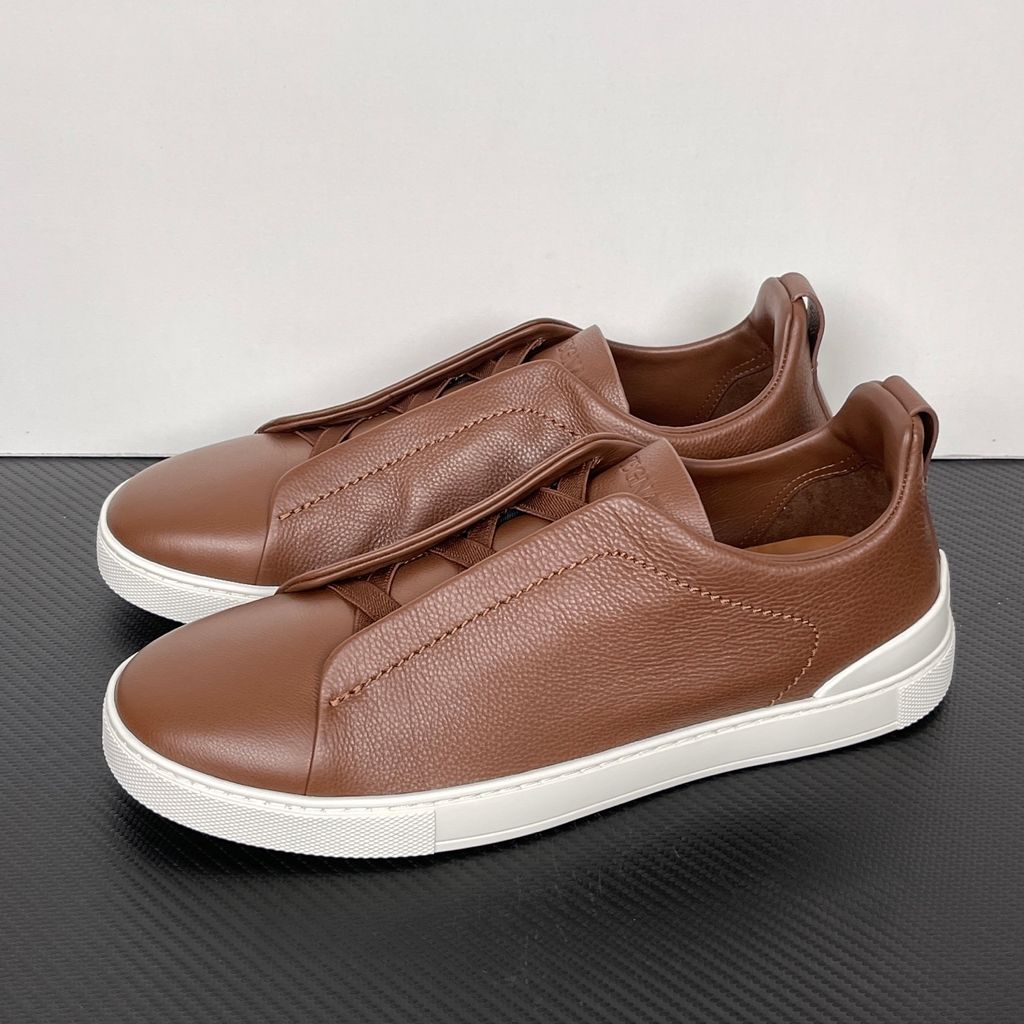 Shop ZEGNA Triple Stitch SECONDSKIN LHOTA-S5207Z-ALM in Almond Brown with soft calf leather, triple-cross elastics, removable footbed and white rubber sole.