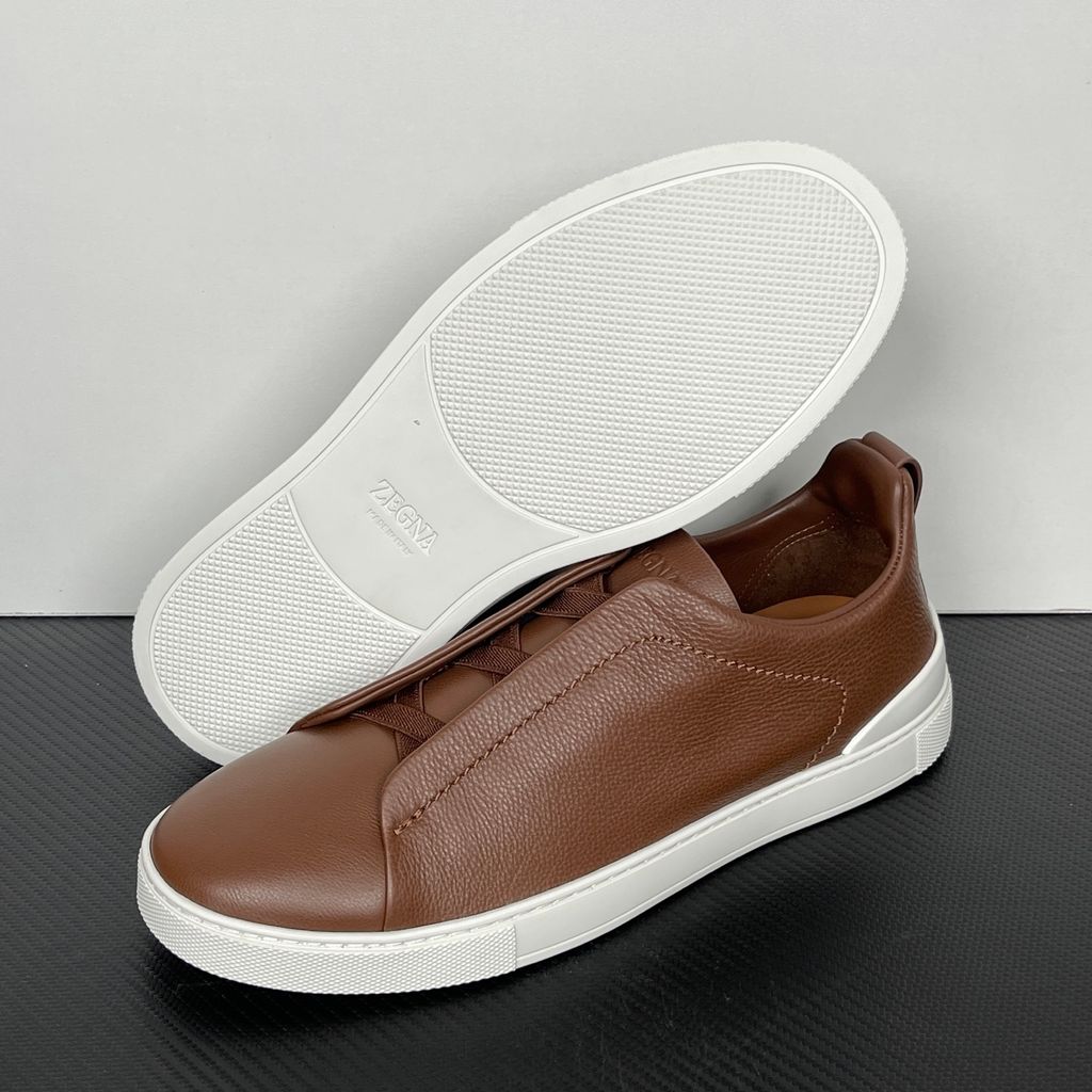 Shop ZEGNA Triple Stitch SECONDSKIN LHOTA-S5207Z-ALM in Almond Brown with soft calf leather, triple-cross elastics, removable footbed and white rubber sole.