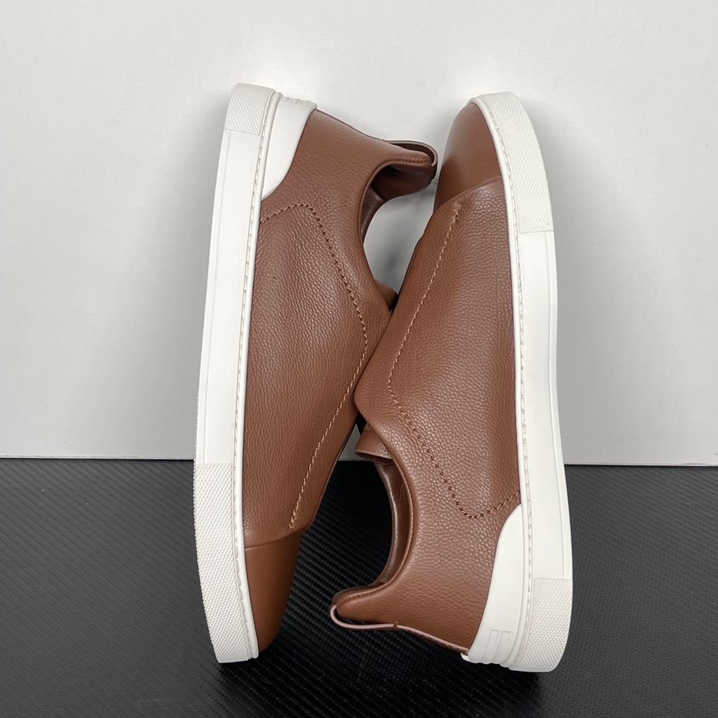 Shop ZEGNA Triple Stitch SECONDSKIN LHOTA-S5207Z-ALM in Almond Brown with soft calf leather, triple-cross elastics, removable footbed and white rubber sole.
