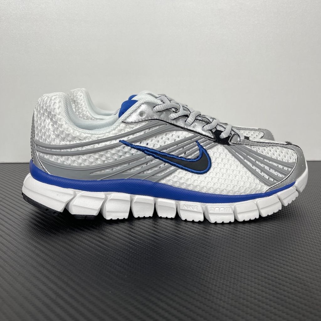 Shop Nike Zoom Skylon 11 IU1869-103 in White, Metallic Silver, Old Royal and Black with heel Air Zoom, Cushlon cushioning and flexible Y2K styling.