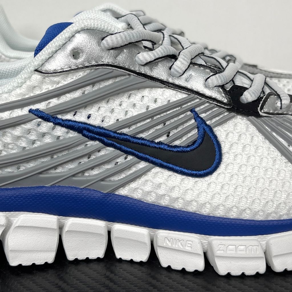 Shop Nike Zoom Skylon 11 IU1869-103 in White, Metallic Silver, Old Royal and Black with heel Air Zoom, Cushlon cushioning and flexible Y2K styling.