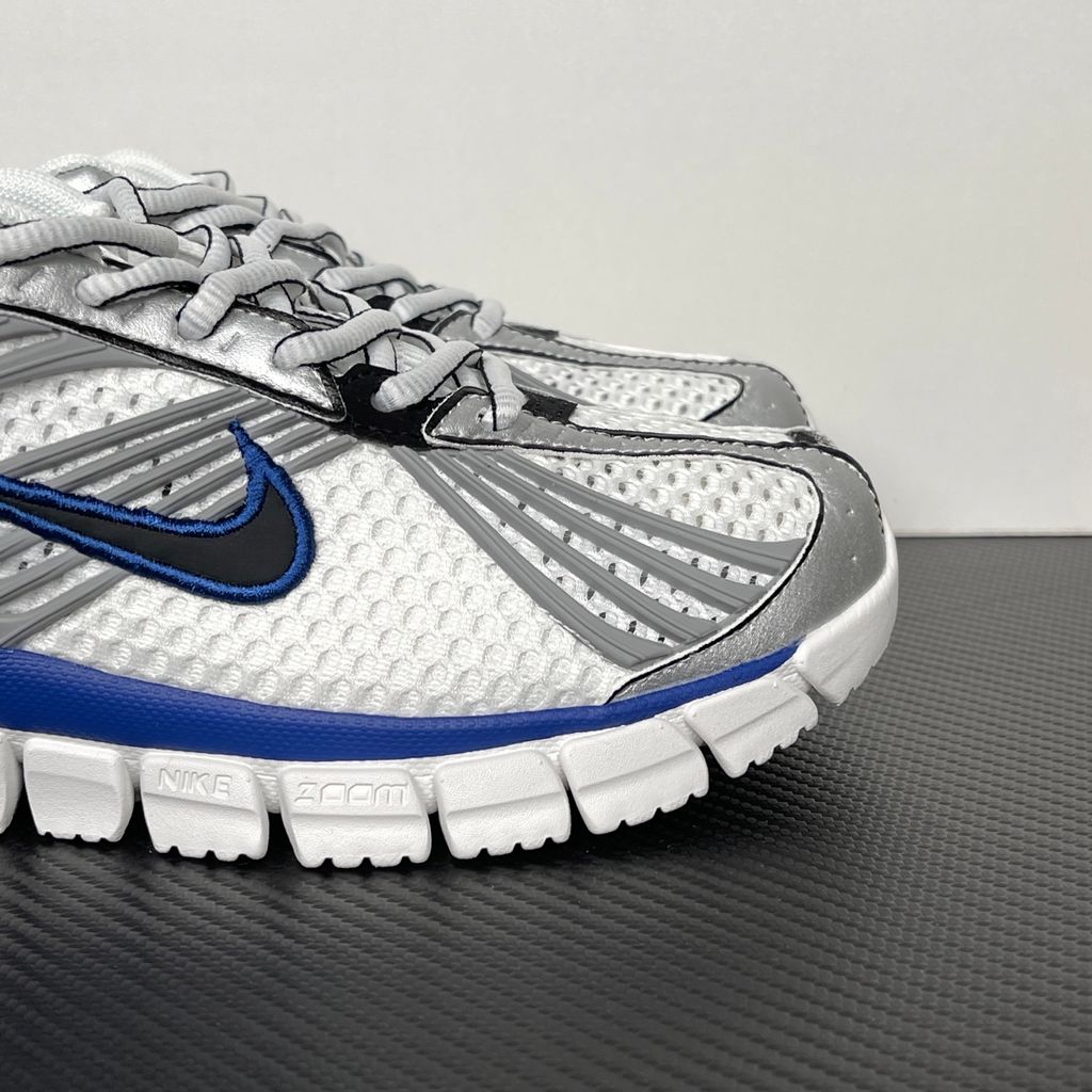 Shop Nike Zoom Skylon 11 IU1869-103 in White, Metallic Silver, Old Royal and Black with heel Air Zoom, Cushlon cushioning and flexible Y2K styling.