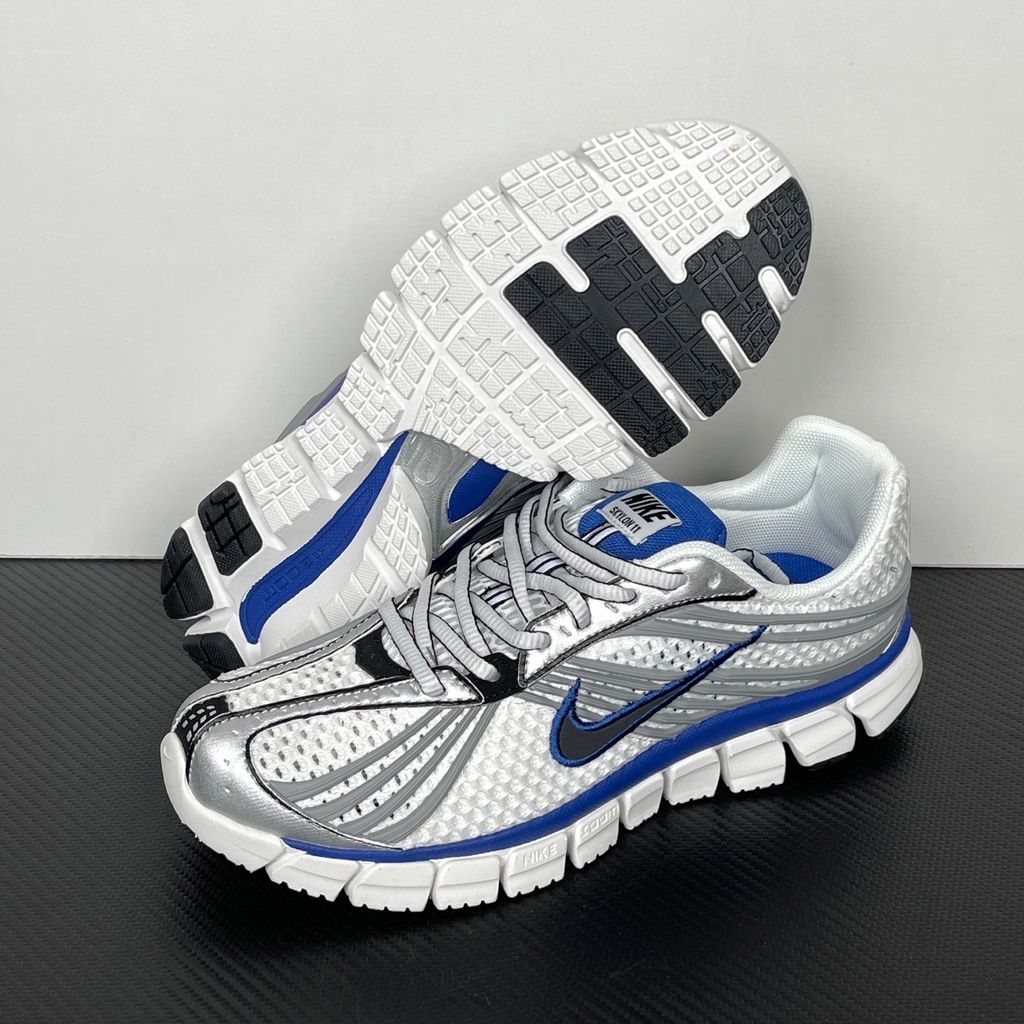 Shop Nike Zoom Skylon 11 IU1869-103 in White, Metallic Silver, Old Royal and Black with heel Air Zoom, Cushlon cushioning and flexible Y2K styling.