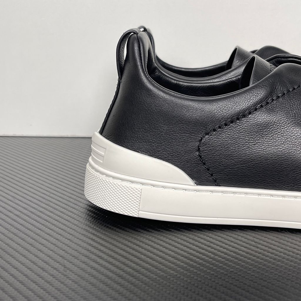 Shop ZEGNA Triple Stitch SECONDSKIN LHOTA-S5207Z-NER in Nero Oasi Black with soft calf leather, triple-cross elastics, removable footbed and white rubber sole.