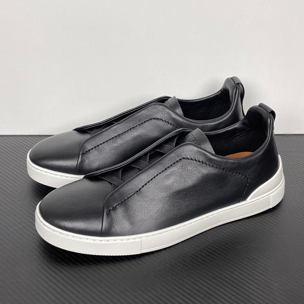 Shop ZEGNA Triple Stitch SECONDSKIN LHOTA-S5207Z-NER in Nero Oasi Black with soft calf leather, triple-cross elastics, removable footbed and white rubber sole.