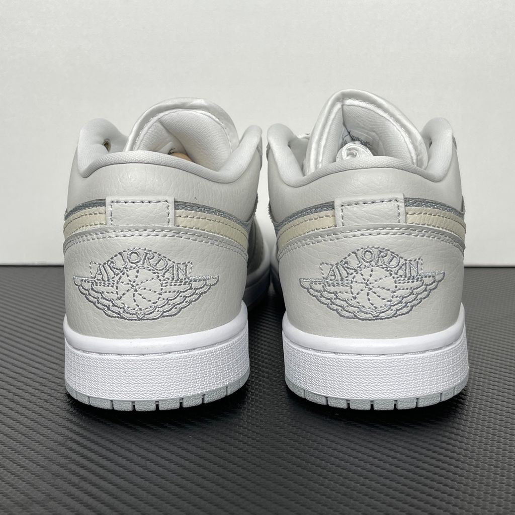 Shop Air Jordan 1 Low SE IO2049-100 in Off-White, Soft Pearl and Light Smoke Grey with genuine leather, Air-Sole cushioning and solid rubber traction.