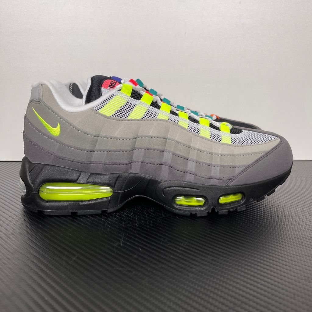 Shop Nike Air Max 95 Big Bubble Premium Greedy IM2211-001 with Neon, Grape, Solar Red and Bright Mandarin accents, visible Max Air cushioning and layered upper.