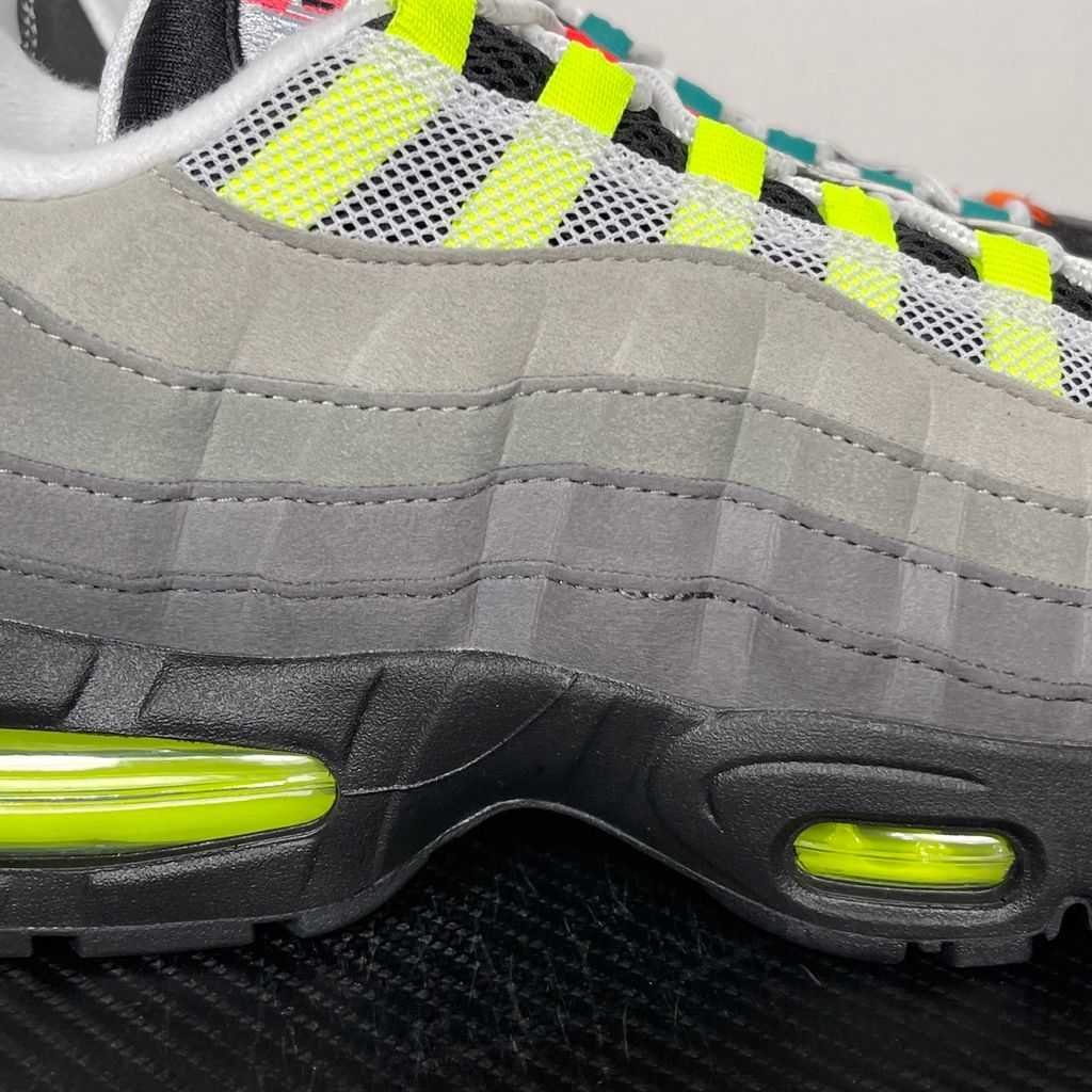 Shop Nike Air Max 95 Big Bubble Premium Greedy IM2211-001 with Neon, Grape, Solar Red and Bright Mandarin accents, visible Max Air cushioning and layered upper.