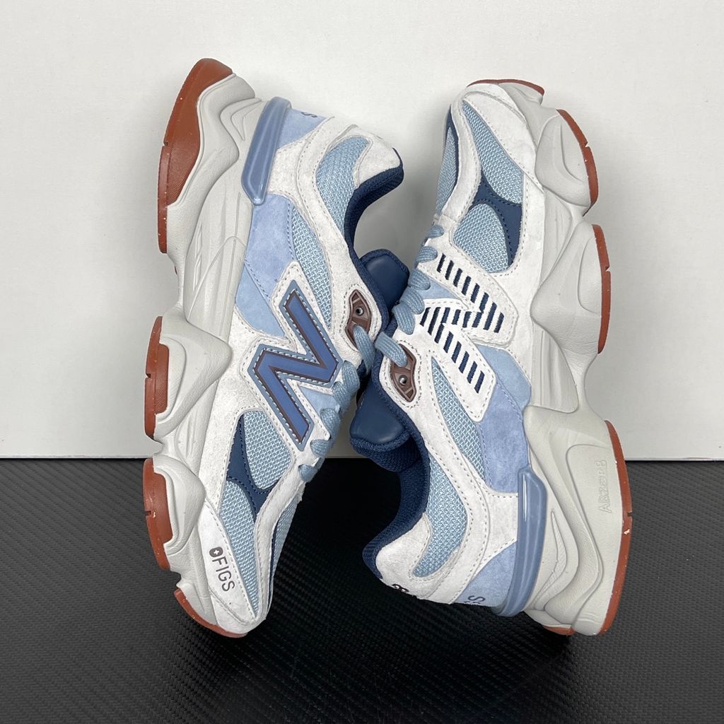 Shop New Balance 9060 U90601T1 in Blue Grey, Cream and Gum with layered mesh and suede styling, ABZORB and SBS cushioning and sculpted Y2K design.