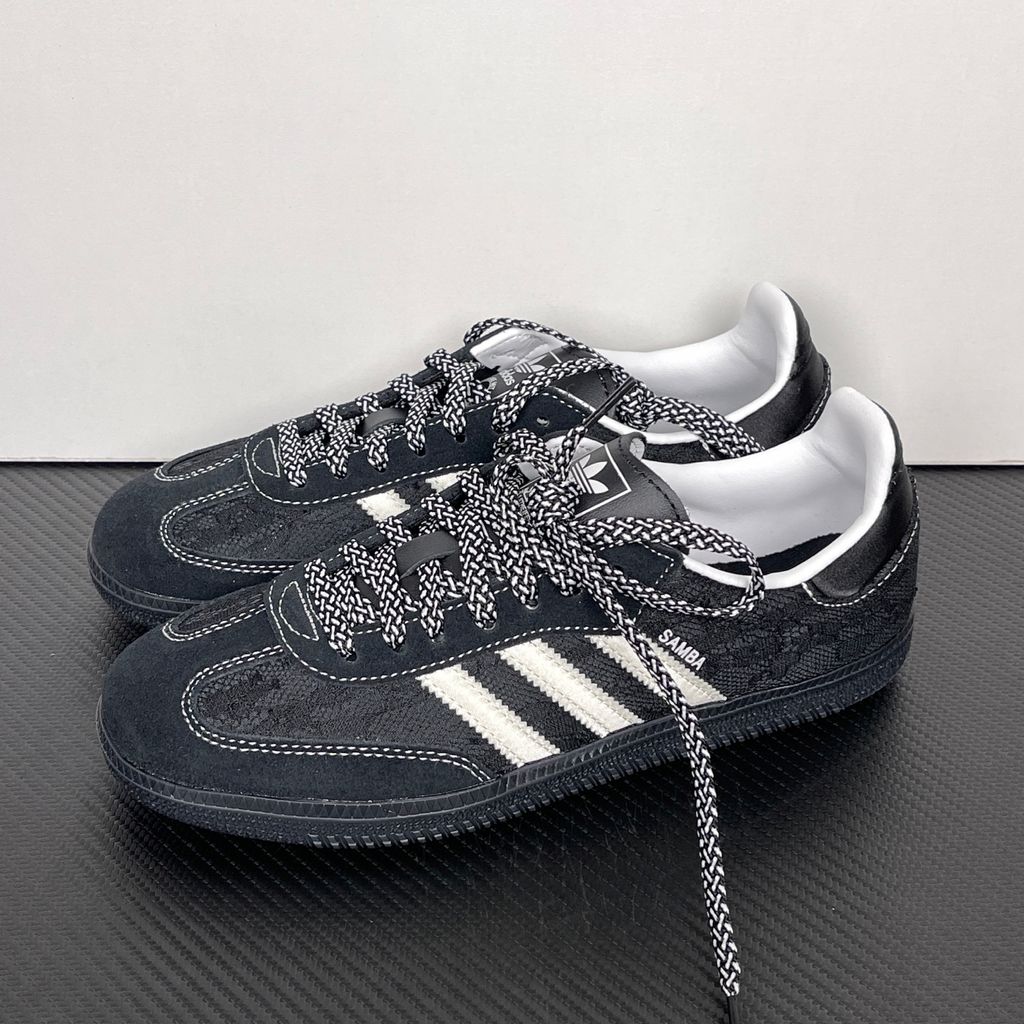 Shop adidas Samba OG W KH7842 in Core Black, Cloud White and Grey One with lace-inspired detailing, contrast stitching and classic low-profile Samba styling.