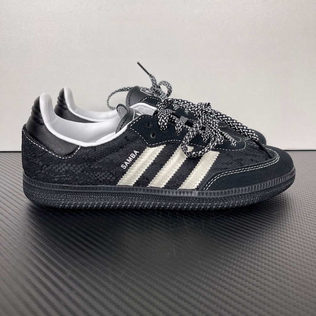 Shop adidas Samba OG W KH7842 in Core Black, Cloud White and Grey One with lace-inspired detailing, contrast stitching and classic low-profile Samba styling.