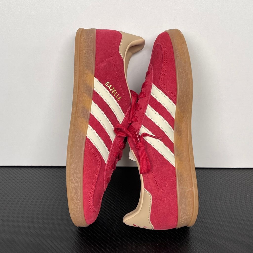 Shop adidas Gazelle Indoor KI2251 in Team Victory Red, Warm Vanilla and Magic Beige with leather upper, classic 3-Stripes, gold Gazelle branding and rubber outsole.