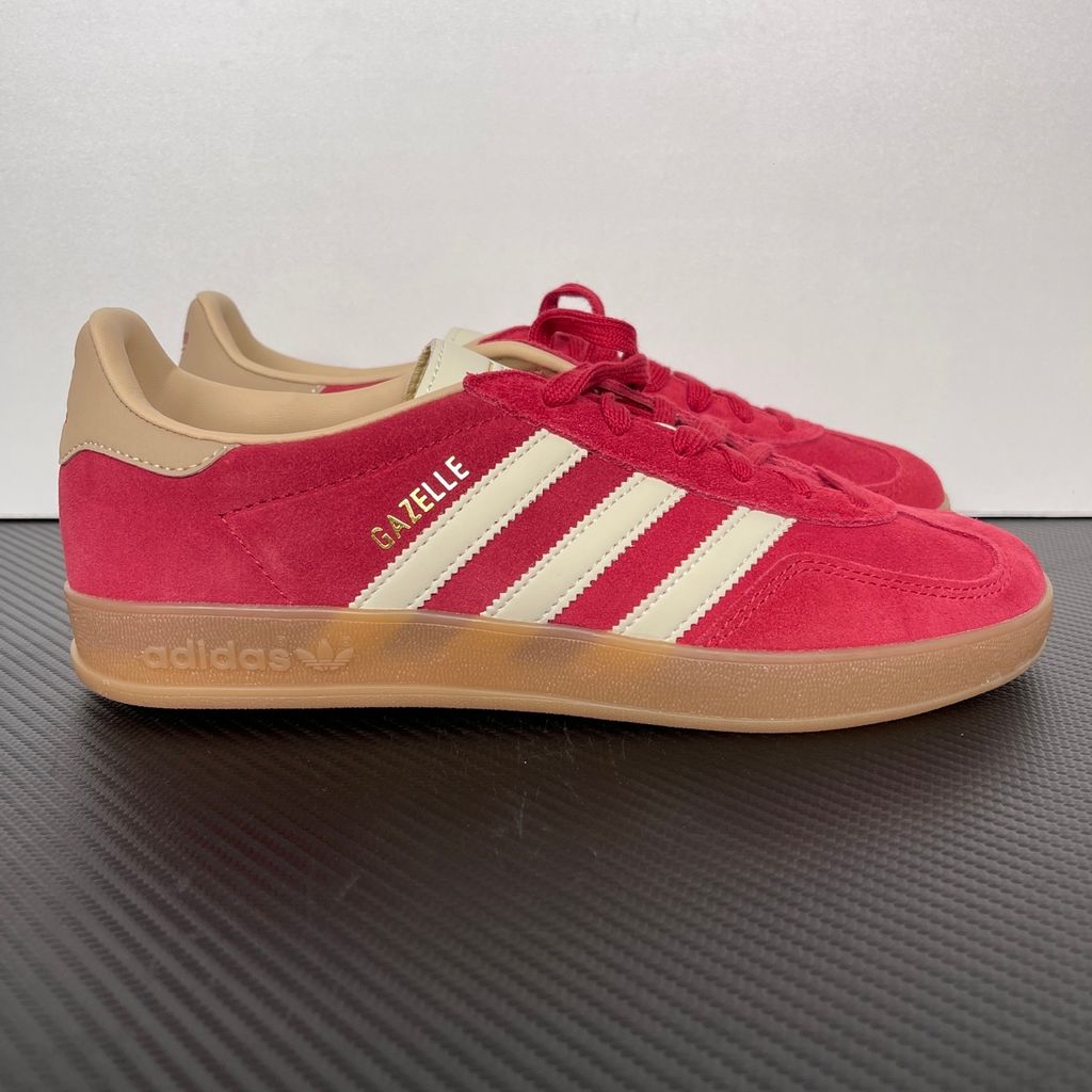 Shop adidas Gazelle Indoor KI2251 in Team Victory Red, Warm Vanilla and Magic Beige with leather upper, classic 3-Stripes, gold Gazelle branding and rubber outsole.
